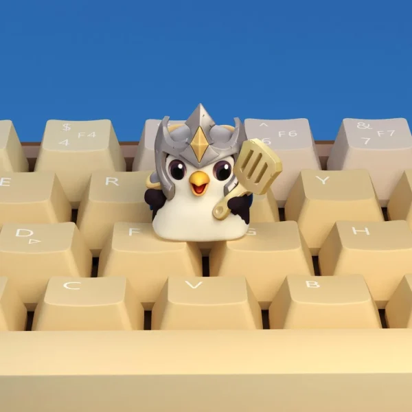 penguin-holding-golden-spatula-keycap-cover