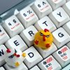yellow-white-unhappy-bird-keycaps-front
