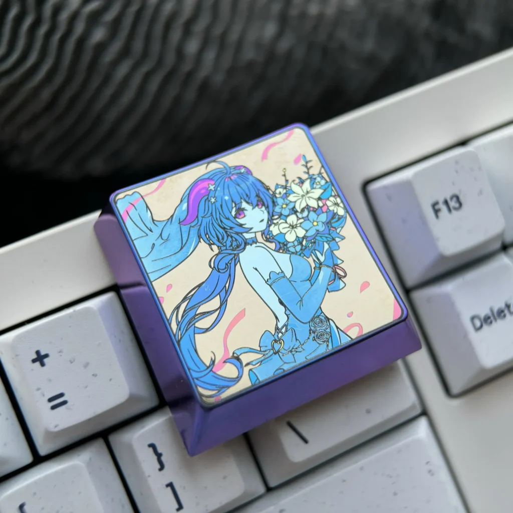These premium Ganyu titanium alloy keycaps, a masterpiece of craftsmanship, showcase the luminous blue titanium metal and exquisite Ganyu character art, possessing a flawless metallic texture.