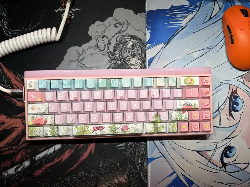 Vibrant pink Kirby keycaps set showcasing iconic Kirby characters for whimsical mechanical keyboard personalization, adding playful charm to any workspace.