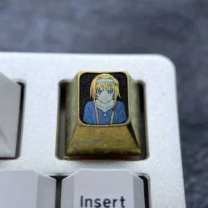 A premium Alice Zuberg Inspired Titanium ESC Keycap gleams with a luxurious ice crystal gold finish, featuring its enchanting custom design for mechanical keyboard.
