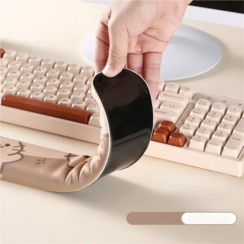 Adorable cat wrist rest crafted from soft, ergonomic silicone, ensuring comfortable keyboard support and a playful desk aesthetic.