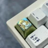 Gallery views of the Aiz Wallenstein Keycap, anodized, highlighting its sleek metallic form, unique design, and premium deisgn.