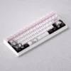 Dynamic view of the exclusive Alisa Mikhailovna Kujou anime keycap set, highlighting playful pastel PBT keycaps and charming schoolgirl illustrations.