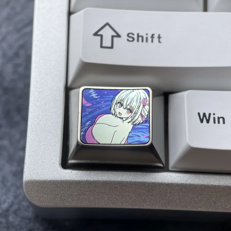 Collection of Chisato Nishikigi Titanium Ctrl Anime Keycaps, showcasing the bold purple character art and shimmering metallic finish for custom.