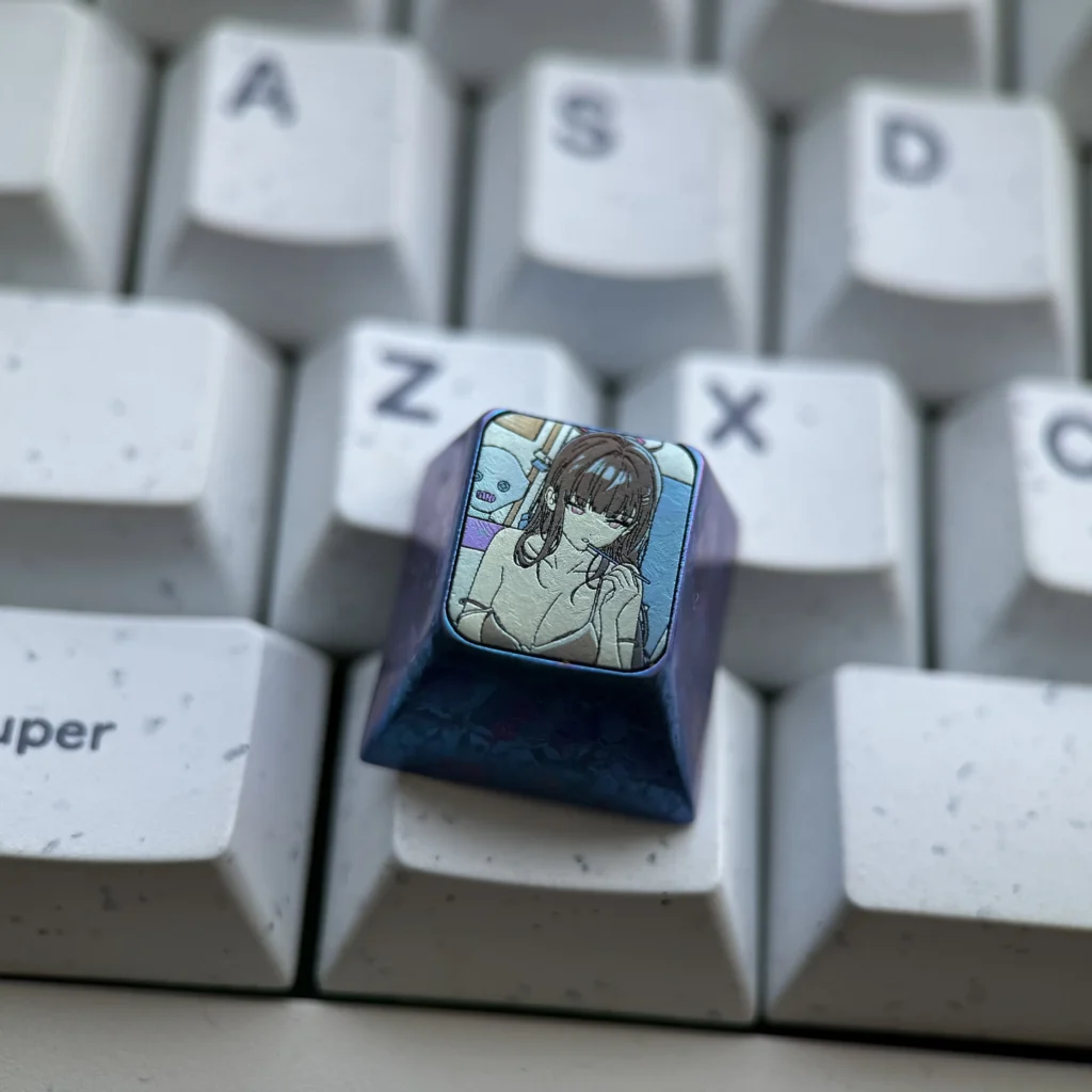 Gallery showcasing the premium Rio Tsukatsuki Anime Keycap from various angles, highlighting its detailed titanium alloy sculpting and vibrant design.