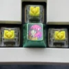 Artistic display of vibrant Anya Forger titanium alloy keycaps, capturing iconic Spy x Family anime flair with lustrous detail.