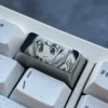 Anya Titanium Keycap gallery showcasing its premium engraved Anya Forger design, sophisticated dark grey titanium, and impeccable craftsmanship.