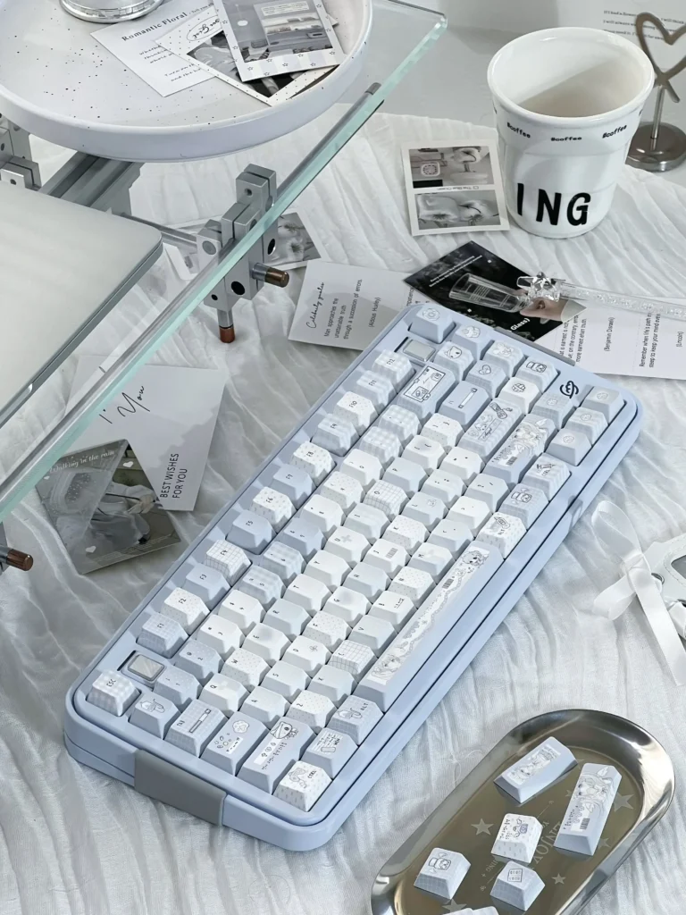 Aqua Angel PBT Keycaps set, showcasing durable PBT and exquisite five-sided dye-sublimation. Ethereal blue hues and angelic motifs convey a premium