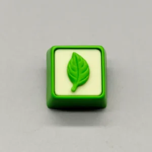 Exquisite handcrafted resin leaf artisan keycap showcasing delicate green leaves elegantly suspended in clear, nature-inspired resin, perfect for your keyboard.