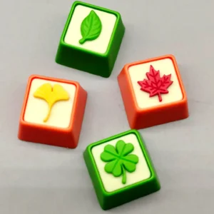 Handcrafted resin artisan leaf keycap displaying delicate green leaves suspended in clear resin, evoking serene nature for mechanical keyboards.