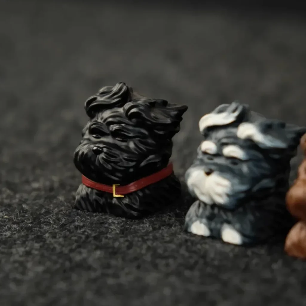Whimsical black puppy artisan keycap handcrafted from resin, showcased from various angles to highlight its unique detail for mechanical keyboards.