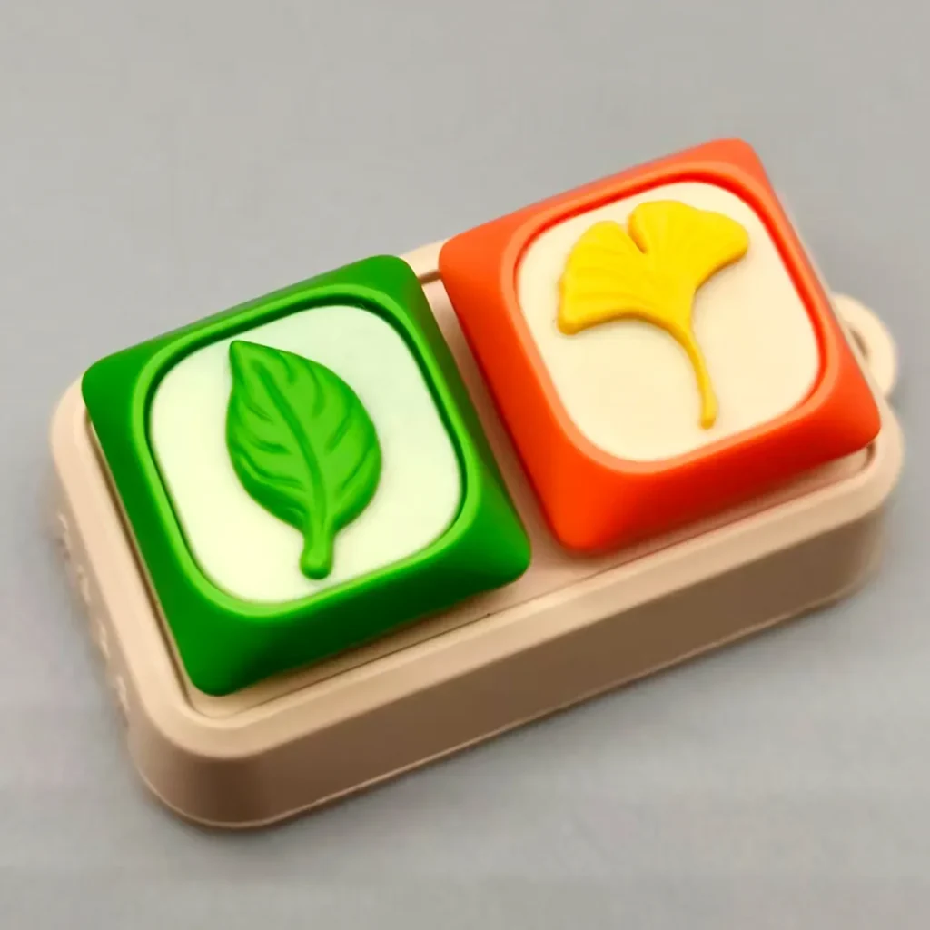 Gallery views of a handcrafted green leaf resin keycap, showcasing its unique artistic design, serene nature motif, and intricate details.