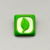 Close-up of a handcrafted green leaf resin keycap, an artistic custom artisan piece bringing a serene touch of nature to MX keyboards.