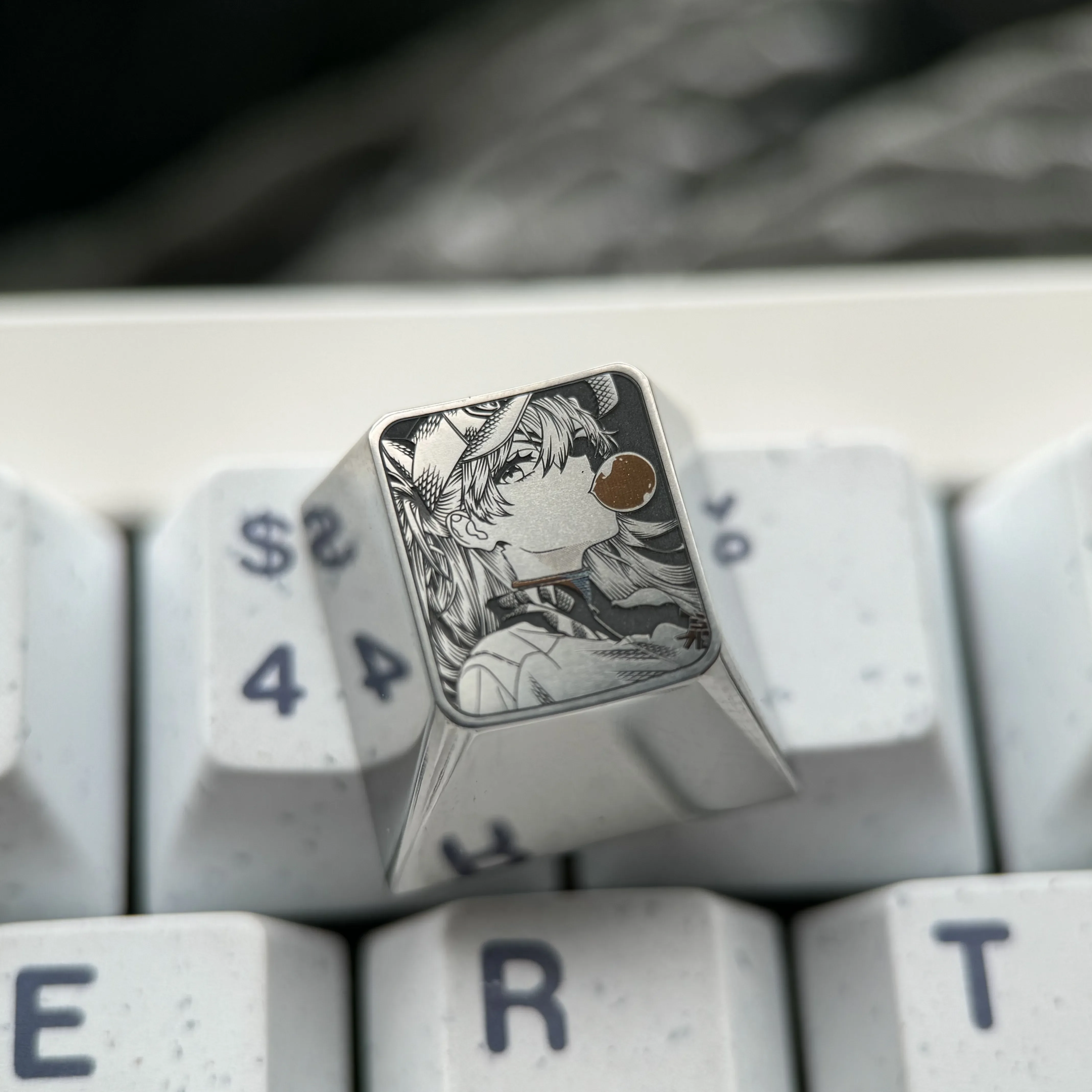 Iconic Asuka titanium keycap showcasing premium pointillist artistry, with Asuka in a dreamy bubble scene. A meticulously crafted artisan ESC keycap.