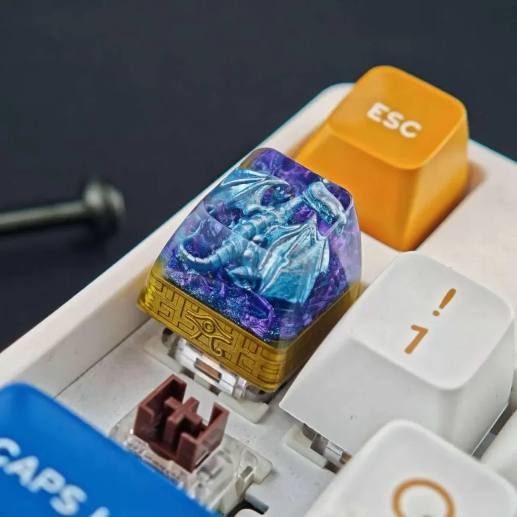 Gallery views of the iconic Blue-Eyes White Dragon translucent resin keycap. Intricate mythical dragon, vibrant glow, artistic design for gaming.
