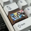 Gallery of the exclusive Bocchi the Rock! titanium keycap, highlighting vibrant anime art from various angles, a premium custom keyboard accessory.