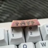 Gallery of the exclusive Bocchi the Rock! titanium keycap. Views highlight vibrant anime art and polished titanium finish, a premium Bocchi Keycap.