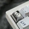 Multiple views of the Bocchi the Rock!: Hitori Gotoh Titanium Keycap, showcasing intricate pointillism art on polished silver.