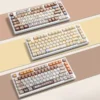 A playful gallery view of the adorable Calico Cat Keycaps Set, showing vibrant, detailed PBT dye-sub designs from multiple angles for custom mechanical keyboard.