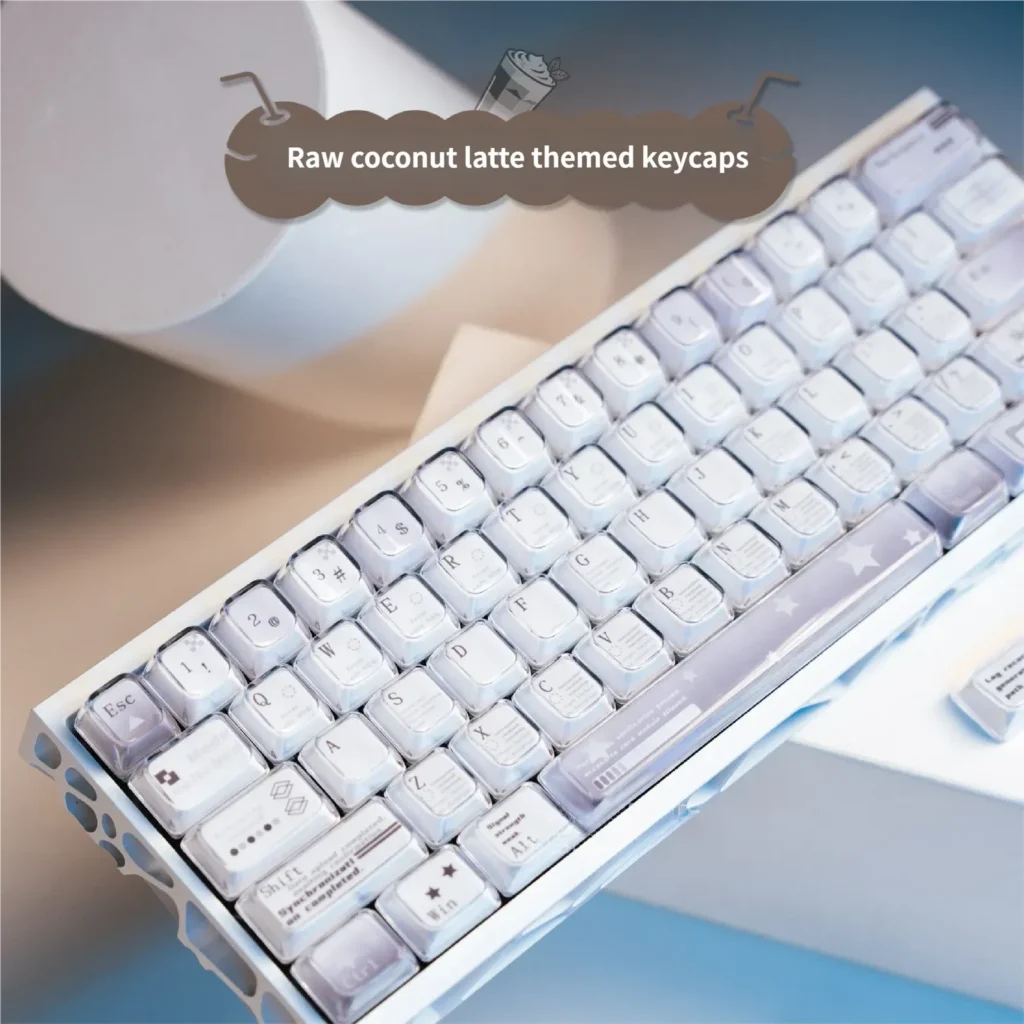 Multiple views of durable dye-sub PBT Coconut Latte Keycaps Set. Soft creams, warm browns, and subtle greens create a cozy, refreshing theme.