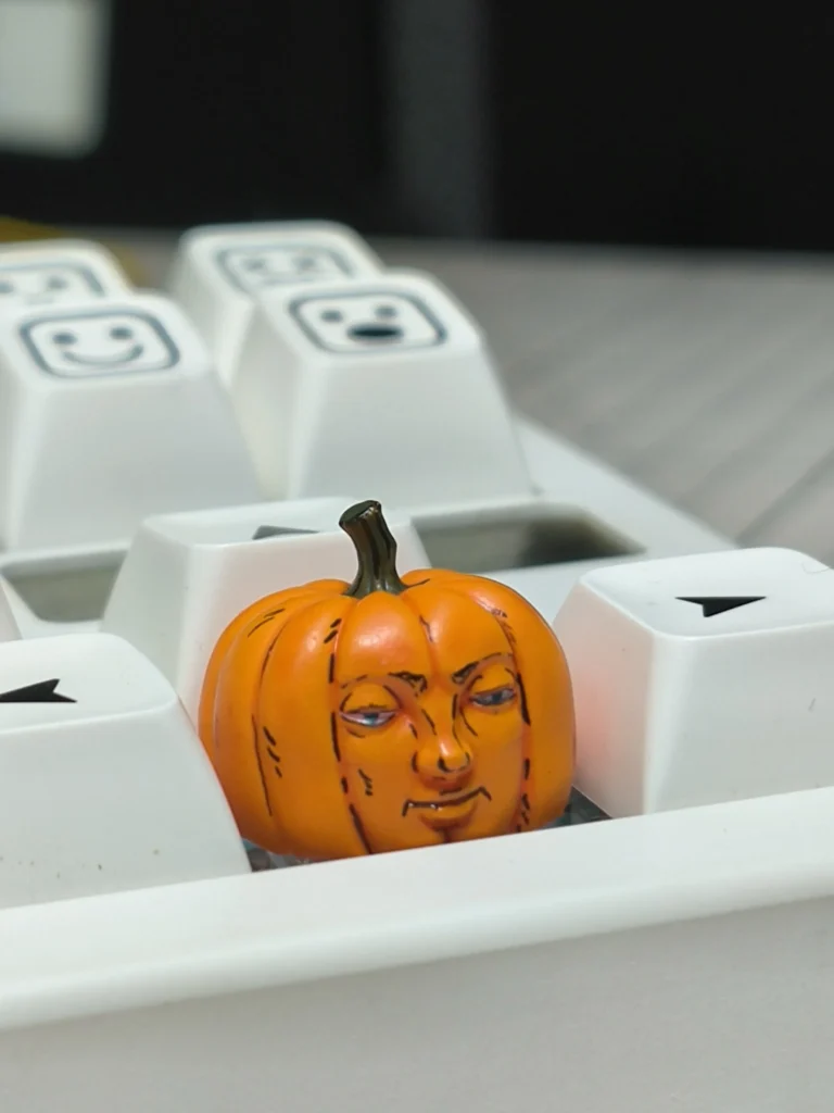 Whimsical handcrafted Dungeon Meshi pumpkin keycap from various angles, showcasing intricate artisan details and playful anime design.