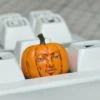 Whimsical handcrafted Dungeon Meshi pumpkin keycap, an anime artisan piece perfect for Halloween, showcasing intricate details.