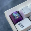 Premium Emilia Titanium Keycap, a premium artisan Halloween custom metal keycap, viewed from various angles showcasing its anime design and anodized design.
