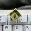 Multiple angles of the premium Ereshkigal Keycap, mystical titanium anime keycap, with intricate motifs, vibrant iridescent colors, and lustrous design.