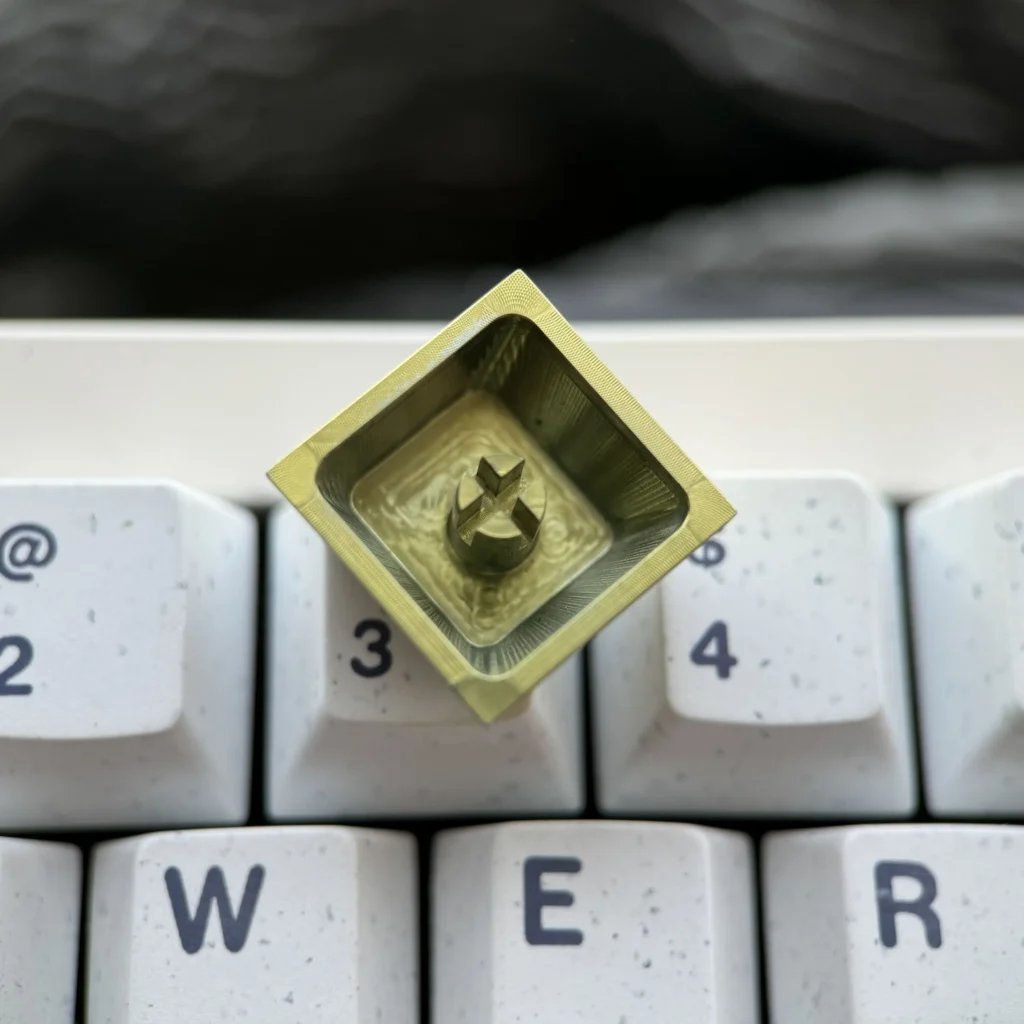 Multiple angles of the premium Ereshkigal Keycap, mystical titanium anime keycap, with intricate motifs, vibrant iridescent colors, and lustrous design.