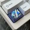 Gallery showcasing the premium anodized Firefly Titanium Anime Keycap, highlighting its ethereal firefly glow, vibrant colors, and intricate metallic design.