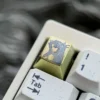 Views of the vibrant titanium Ishtar artisan keycap, highlighting its celestial anime goddess design, intricate details, and premium finish.
