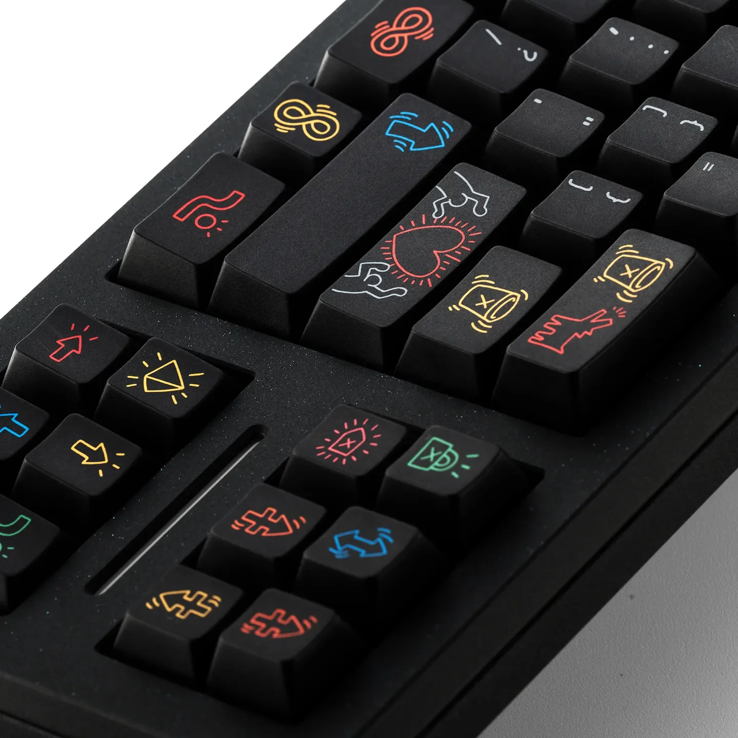 Gallery view of the iconic Keith Haring Graffiti PBT Keycap set, showcasing bold urban art designs from multiple angles and highlighting premium PBT material.
