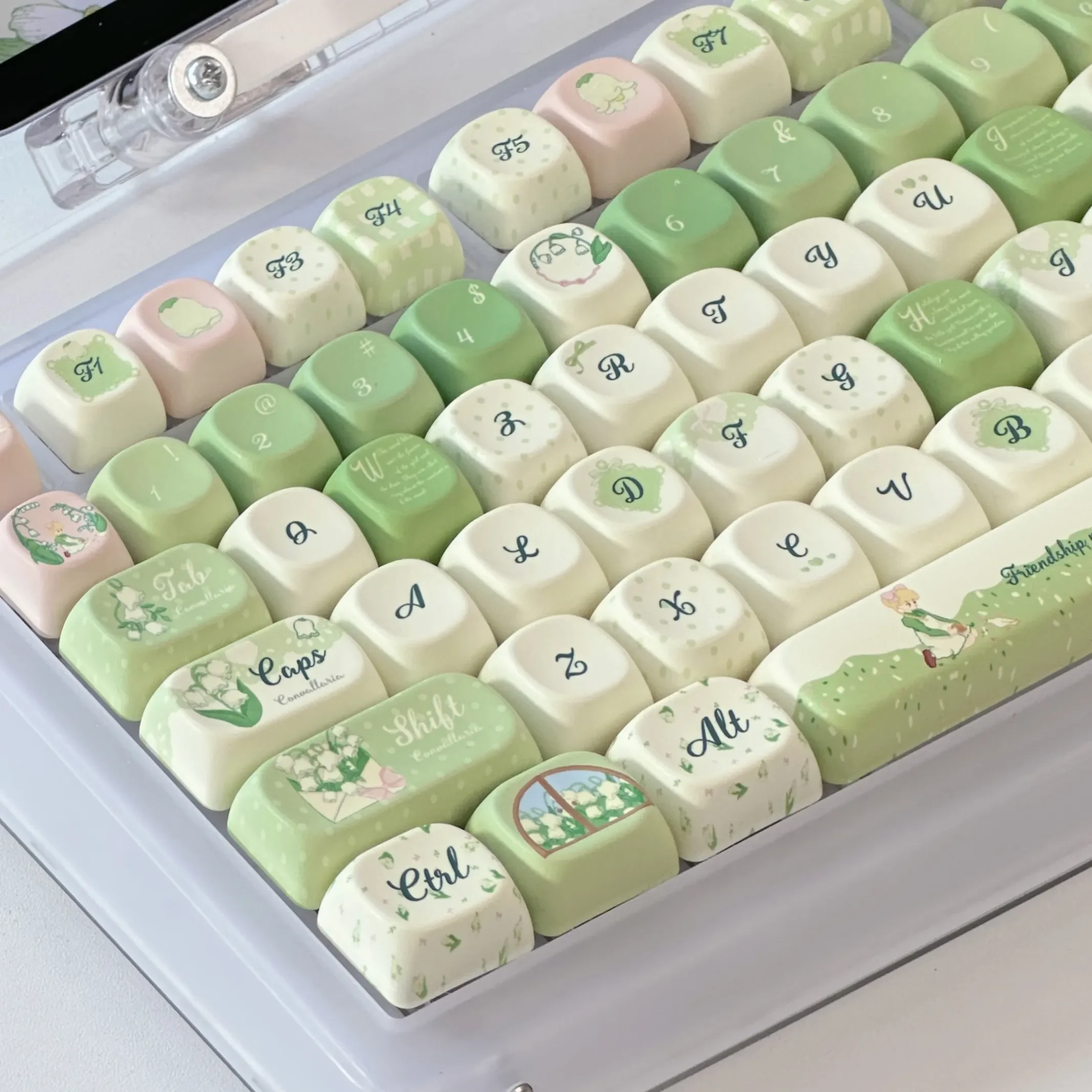 Exquisite Lily of the Valley keycaps set, displaying dreamy floral designs, soft pastels, and a whimsical XOA profile.