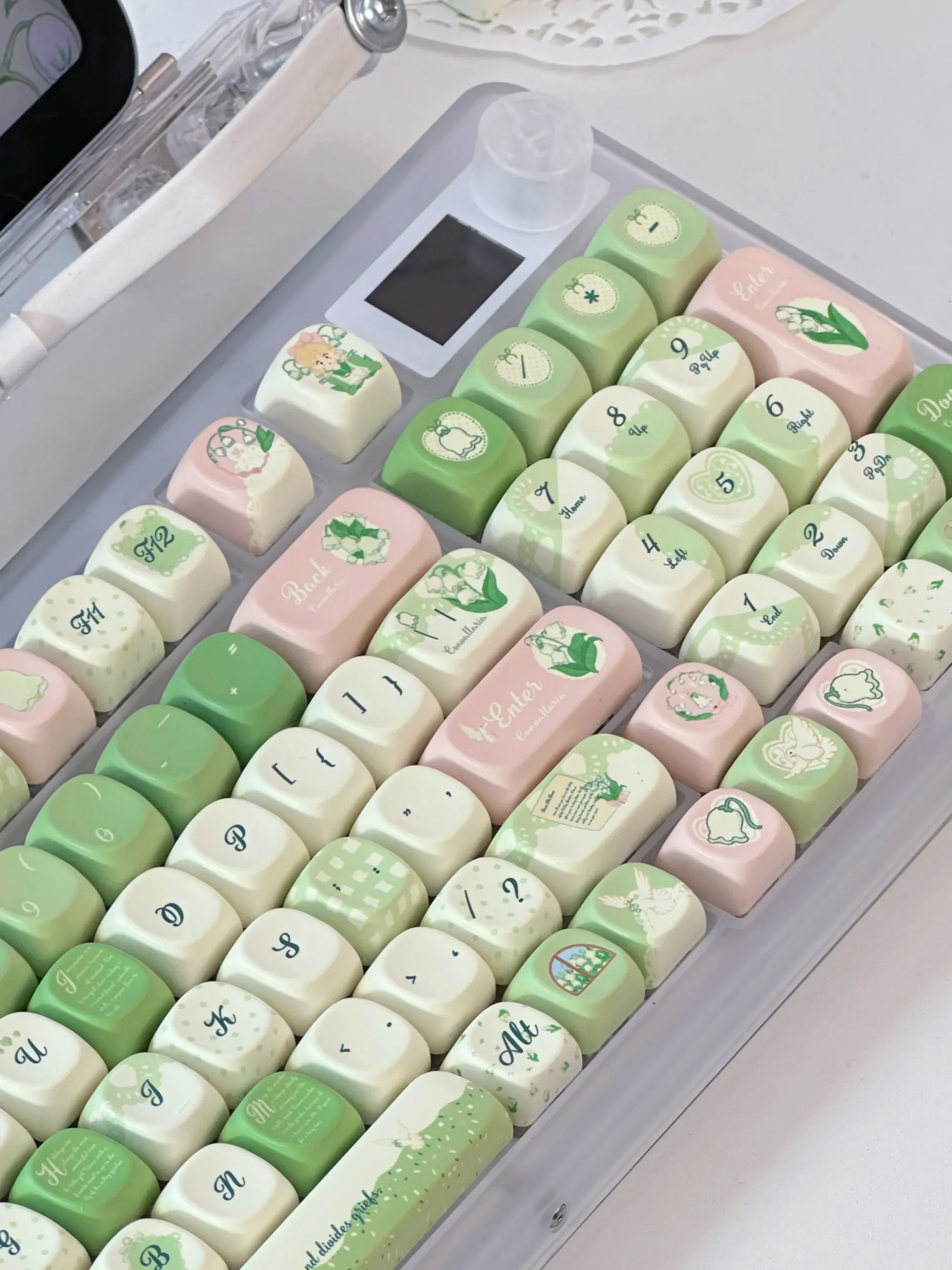 Multiple views of the exquisite Lily of the Valley keycaps set, highlighting dreamy floral patterns and rounded XOA profile for custom keyboards.