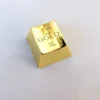 A luxurious gold ESC keycap, showcasing intricate laser engraving and its substantial, premium feel. Elevate your keyboard.