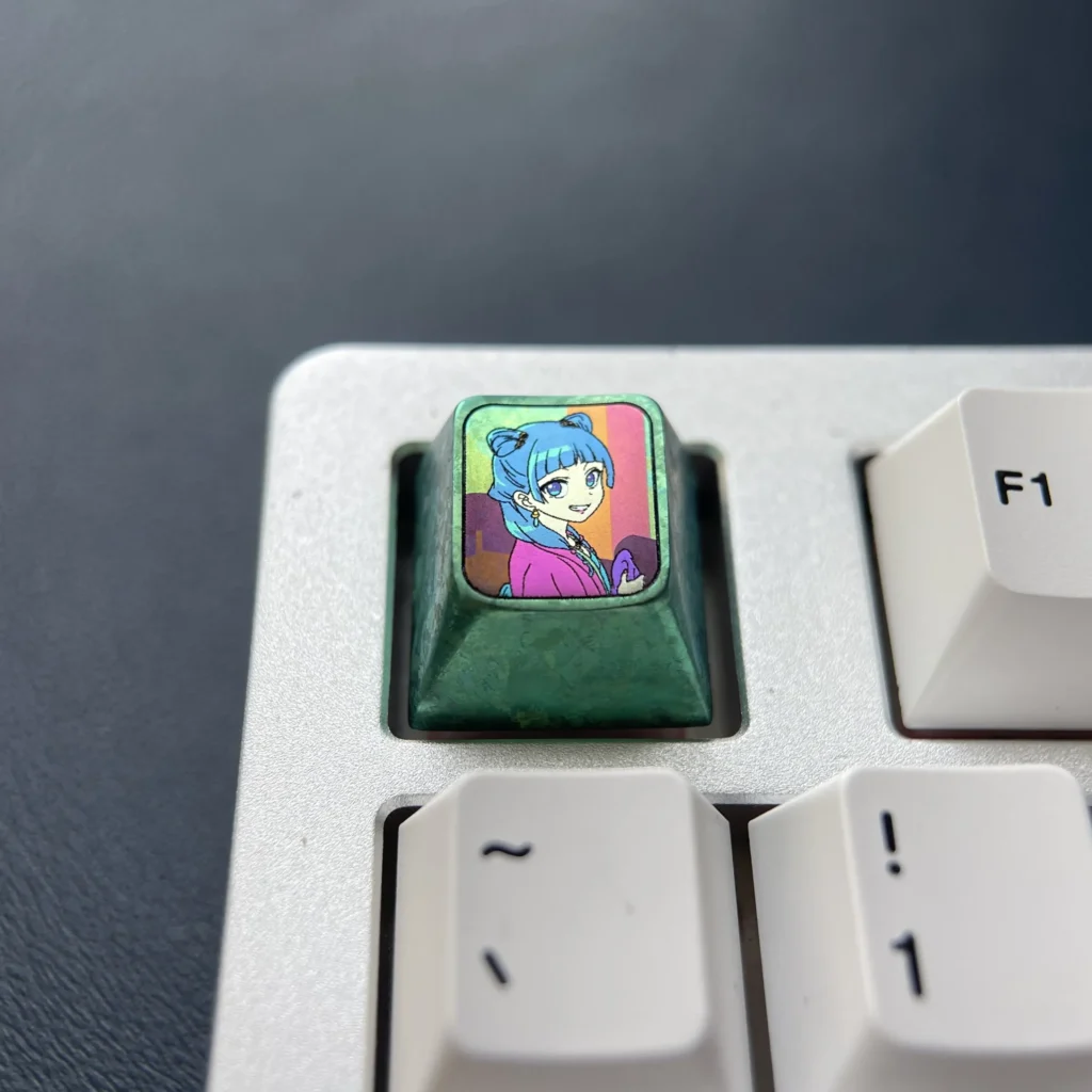 Premium Titanium Maomao ESC Keycap, showcasing vivid anime cat art and a polished metallic finish, embodying The Apothecary Diaries fantasy charm.