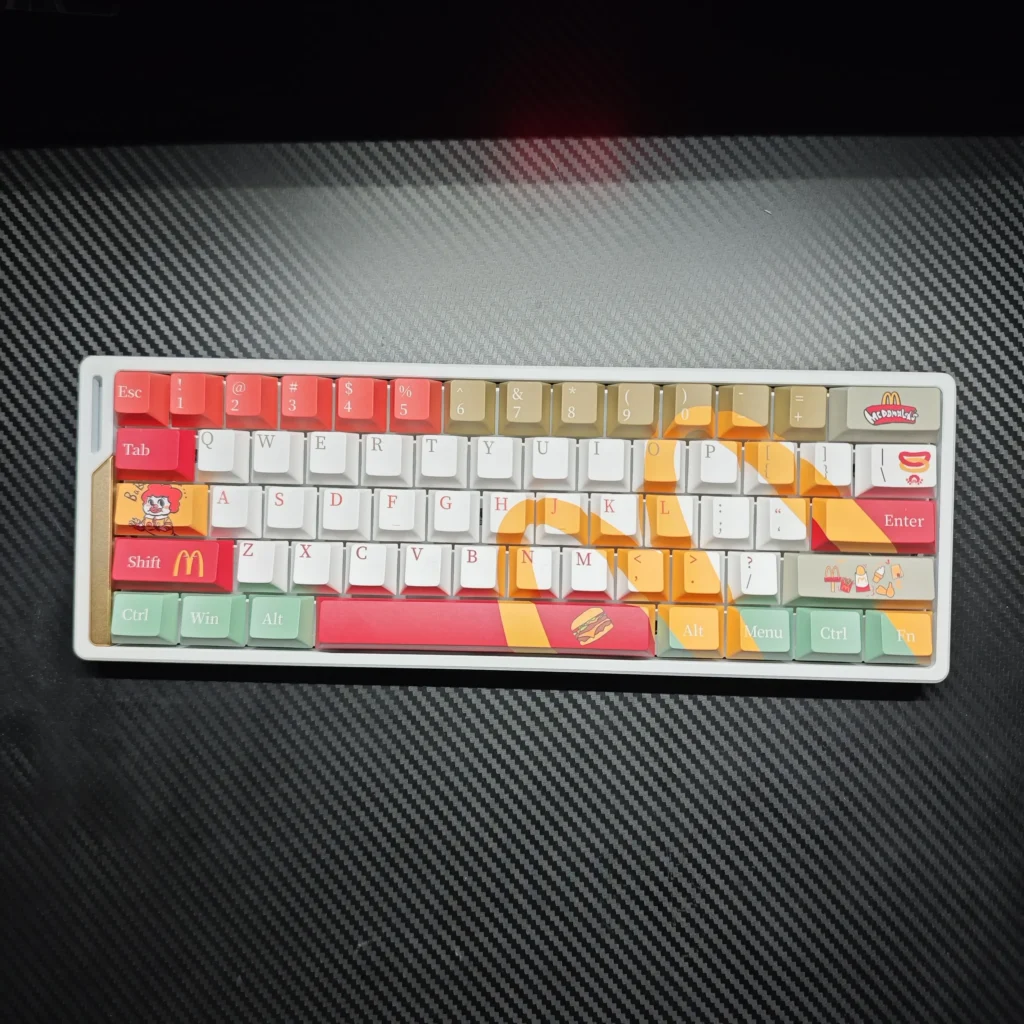 McDonald's Themed Keycaps set, a playful, iconic design featuring bold red and yellow pop culture inspired graphics, bringing nostalgic fun to your keyboard.