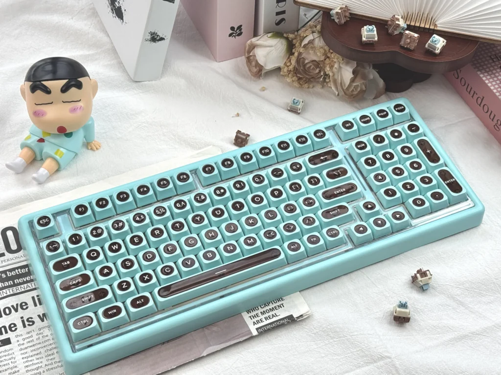 Ainbell Base99 tri-mode hot-swappable mechanical keyboard featuring a charming mint chocolate color palette and elegant, clean design.