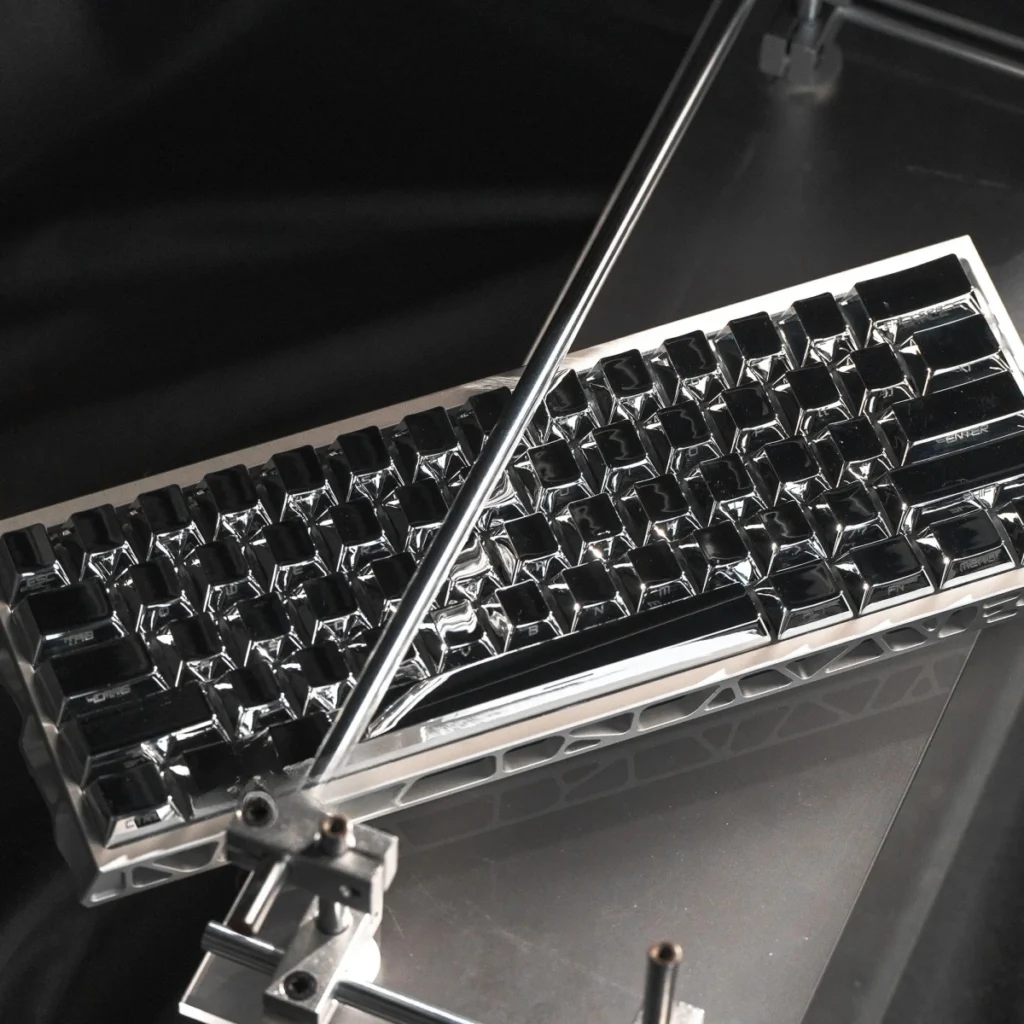 Sleek, Mirror Themed Cherry Keycap Set reflecting light, showcasing their luxurious finish and hinting at a surprisingly lightweight, warm design.