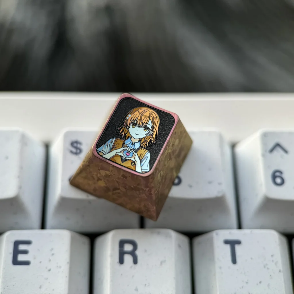 Explore multiple angles of this Premium Titanium Misaka Mikoto Keycap, highlighting its vibrant anime design and exquisite metallic finish.