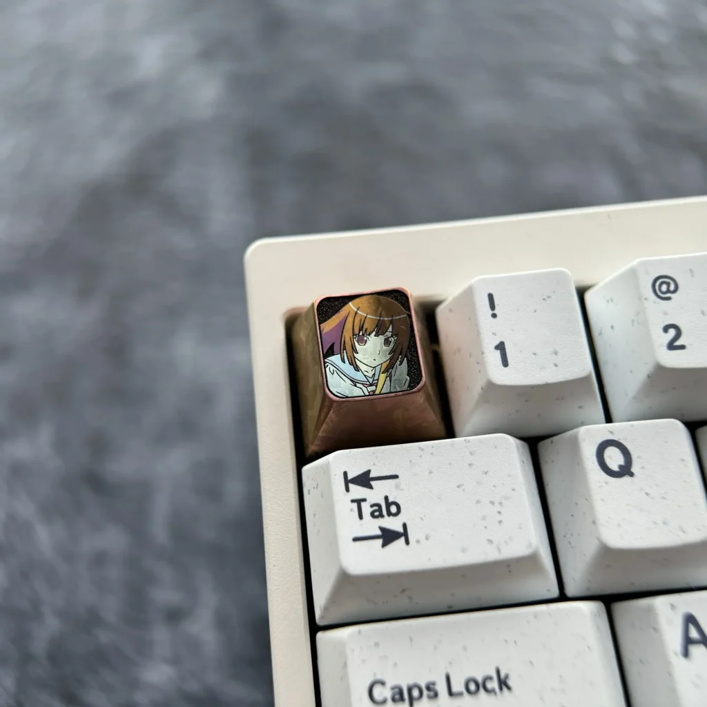 Multiple views of the artistic Sengoku Nadeko keycap, highlighting its distinctive chocolate color, intricate design, and premium finish.