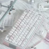 Night Walking Keycap Set gallery. View the whimsical pastel pink and soft white keycaps from multiple angles. Unique original Asian designs.