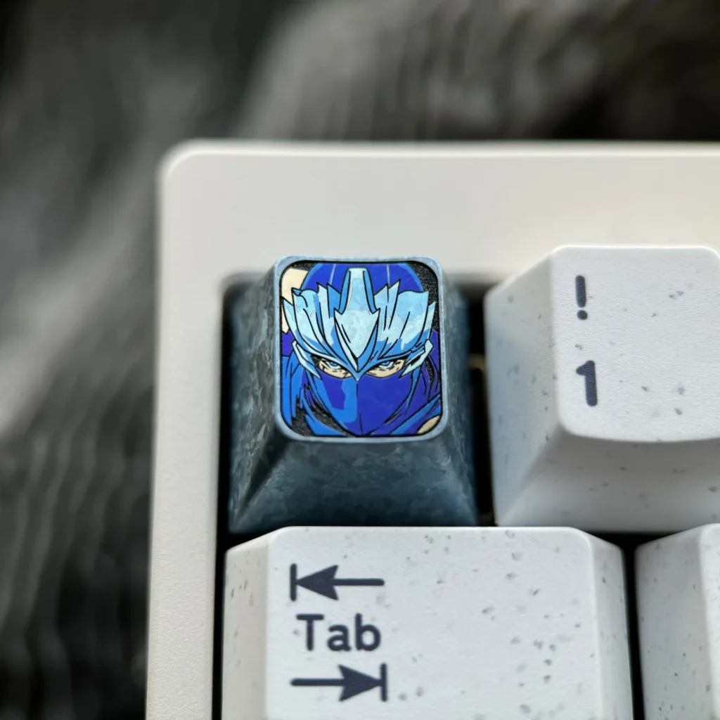 Ninja Gaiden: Ryu Hayabusa Keycap in stunning Ice Crystal Grey, highlighting its sleek metallic finish and premium aerospace alloy.