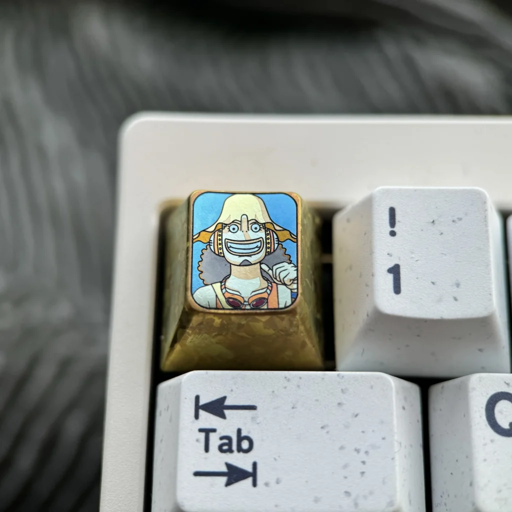 Premium Titanium ONE PIECE artisan keycap, featuring the iconic One Piece character with intricate metal craftsmanship for mechanical keyboards.