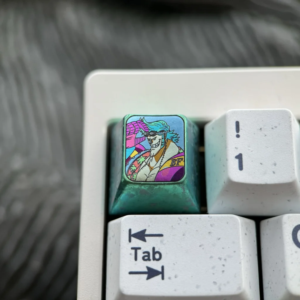 Premium Titanium ONE PIECE Artisan Keycap for mechanical keyboards, featuring iconic One Piece adventure design and intricate craftsmanship.