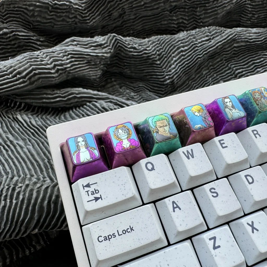 Premium Titanium ONE PIECE keycap for mechanical keyboards, showcasing intricate metal craftsmanship and vibrant One Piece character design.