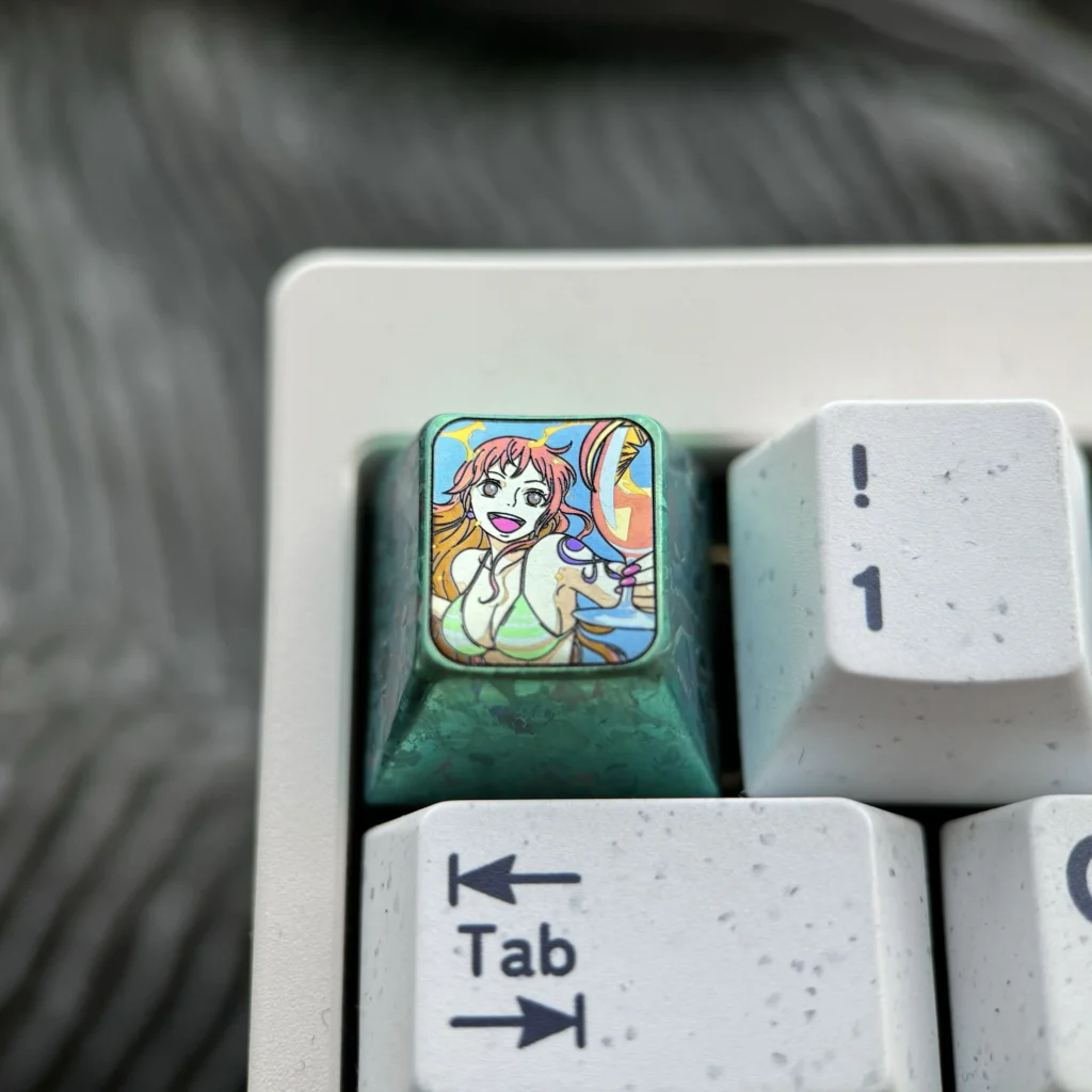 Premium Titanium ONE PIECE artisan keycap, capturing the vibrant One Piece adventure with intricate metal craftsmanship for mechanical keyboards.