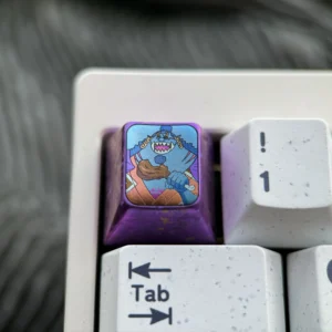 Premium Titanium ONE PIECE artisan keycap for mechanical keyboards, showcasing vibrant One Piece anime character design and intricate metal craftsmanship.