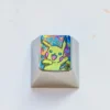Iconic Pikachu titanium alloy keycap for mechanical keyboards, showcasing premium craftsmanship and a vibrant metallic sheen.